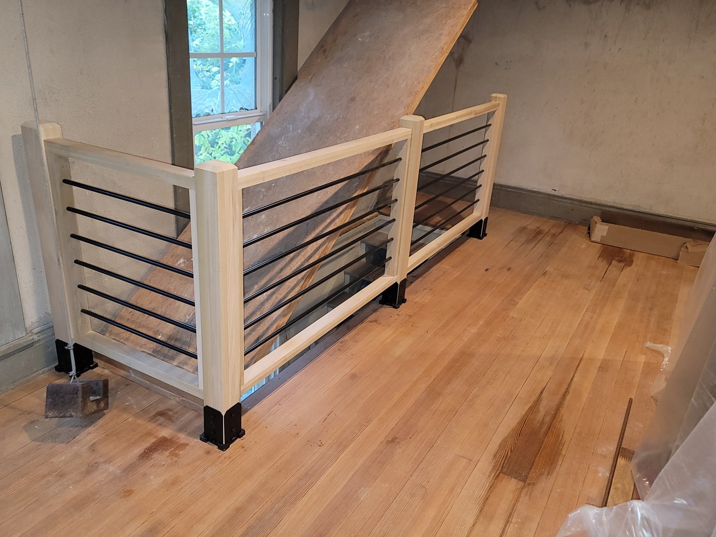 Modern horizontal metal on hardwood by Hansen Construction, Bellevue